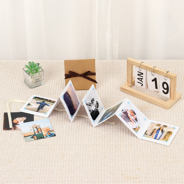 Logotipo personalizado de la altura Kraft Paper Ribbon Knot plegado de acordeón El álbum de fotos Memory Postcard para graduación Cumpleaños Familia de bebé
